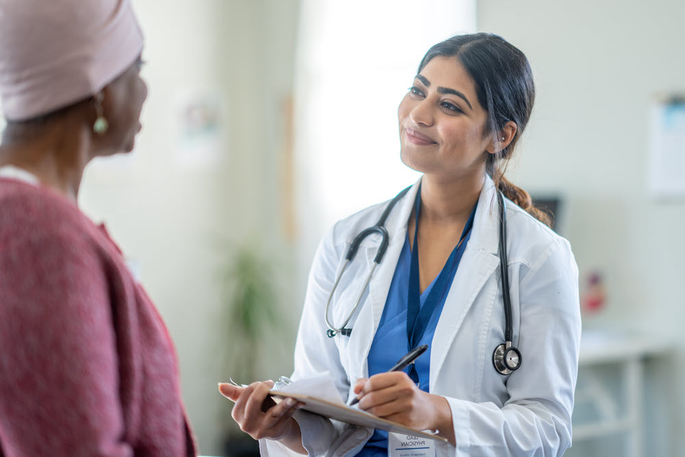 Medical professional speaking with patient