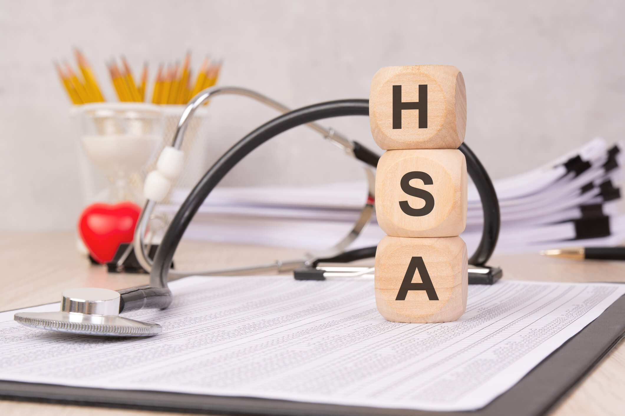 Wooden blocks lined up to spell "HSA"