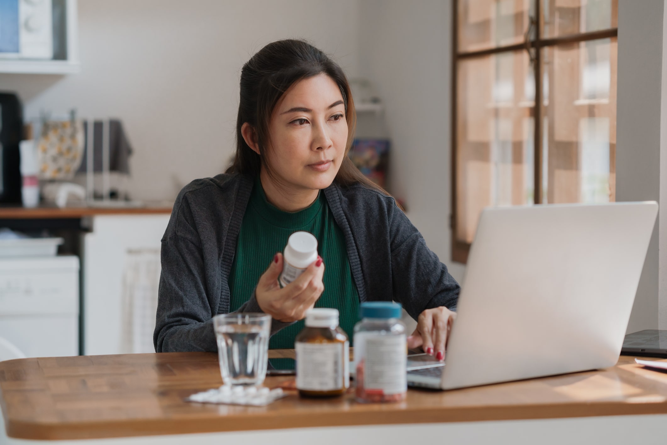 Young woman reviewing her prescriptions 