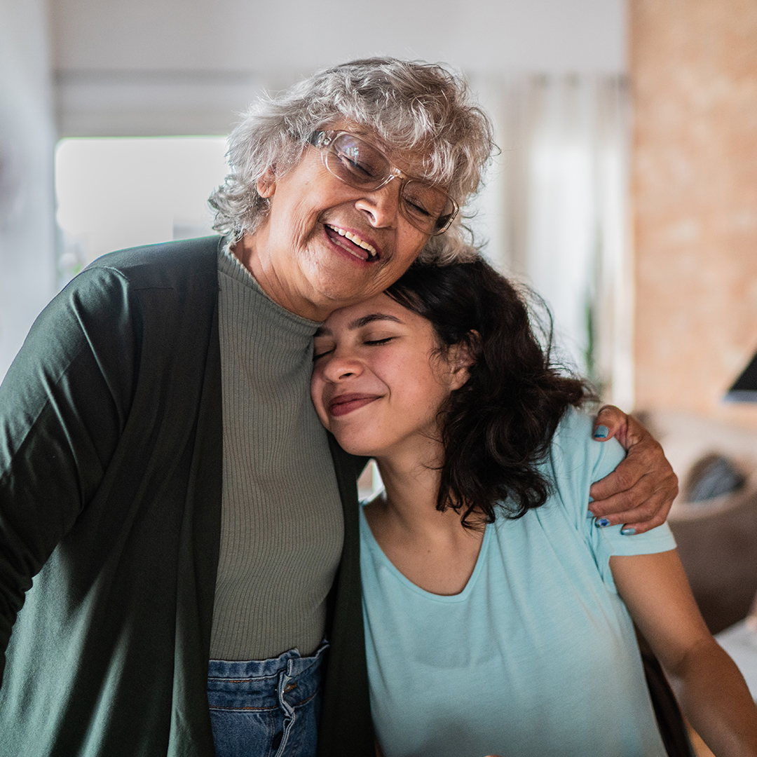 grandmother and daughter embracing