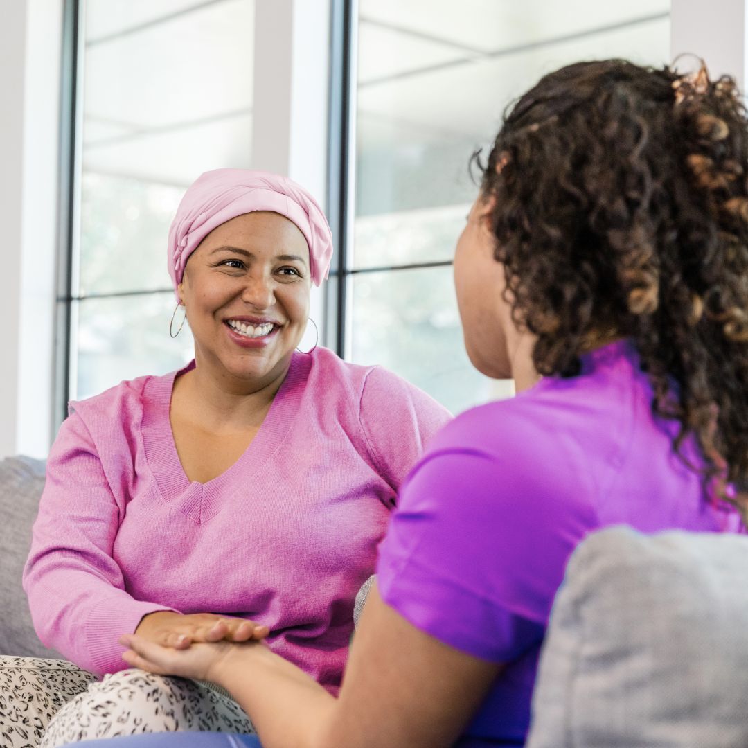 Two women holding hands
